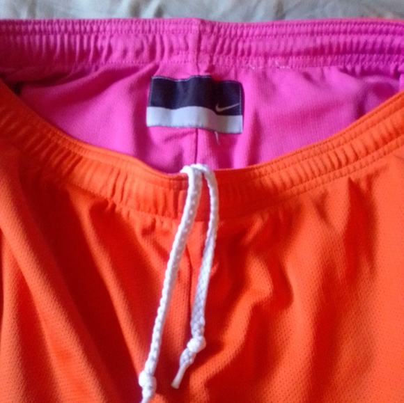 2 pairs Nike activewear shorts - 1 blue white pair, 1 orange pink neon pair - Picture 6 of 7